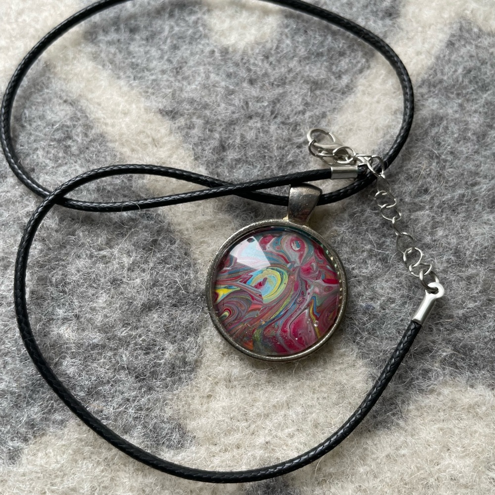 Leather chain with pendant.
